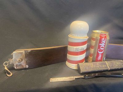 (3) Antique Barber Collectables - Razor Strap, Shumate Razor w/Box & Barber's Pole Blade Bank
Keywords: Antique;Barber Collectables;Razor Strap;Blade Bank;eldred;allcpgphotos